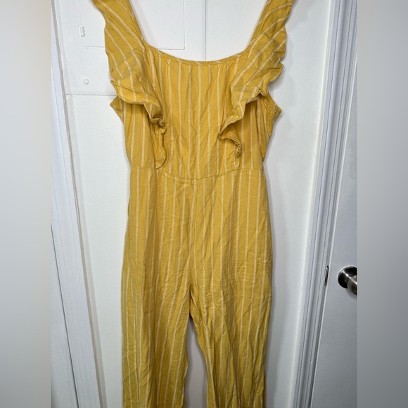 Yellow pinstripe tie back jumpsuit with front ruffle & adjustable straps. Size M - Picture 5 of 8